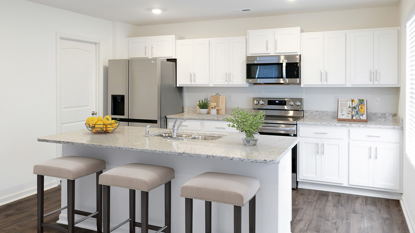 The modern kitchen is roomy enough for the whole family to eat and cook together.