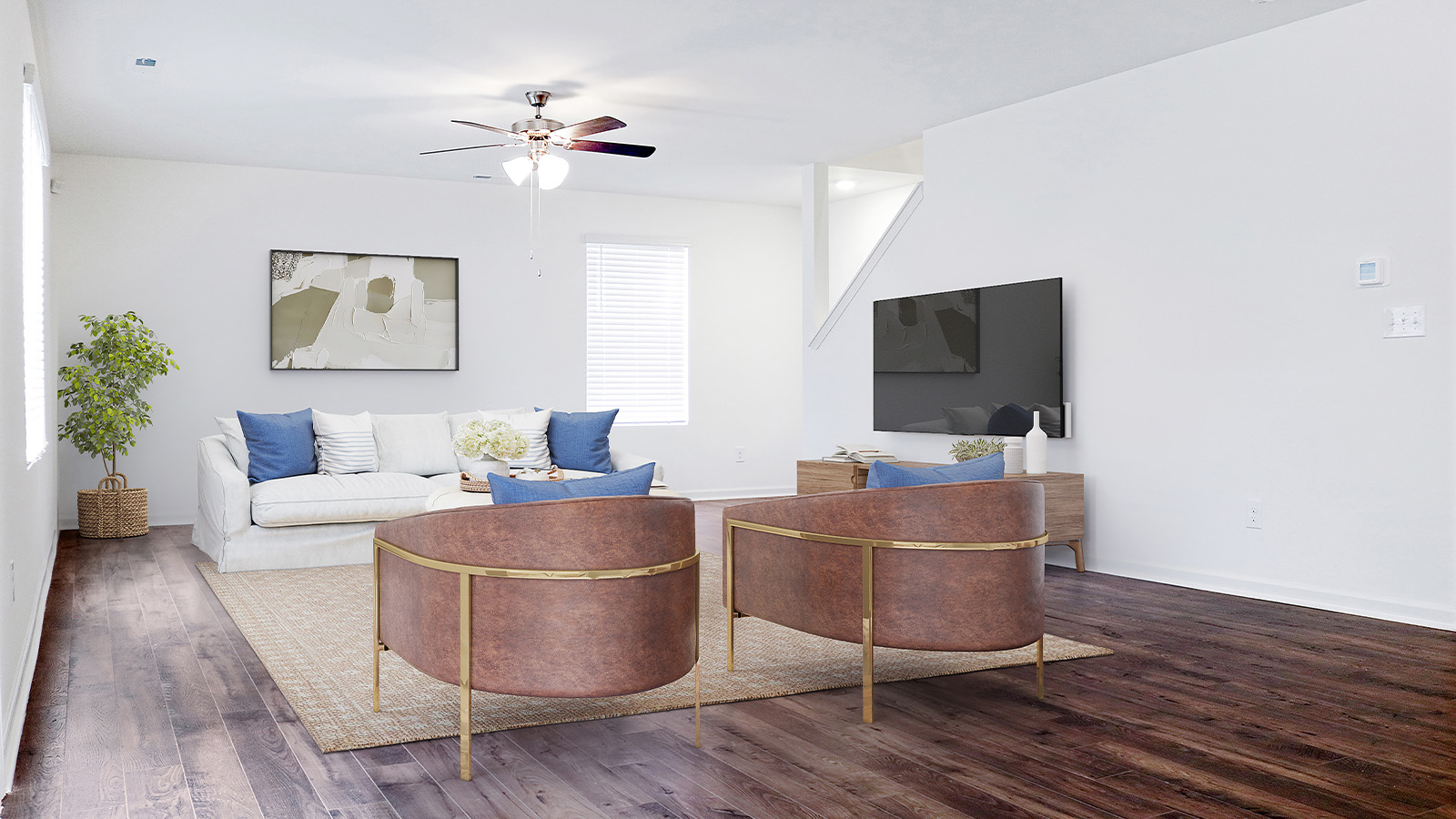 Another view of the spacious living room, here staged with a large couch, large coffee table, and two armchairs.