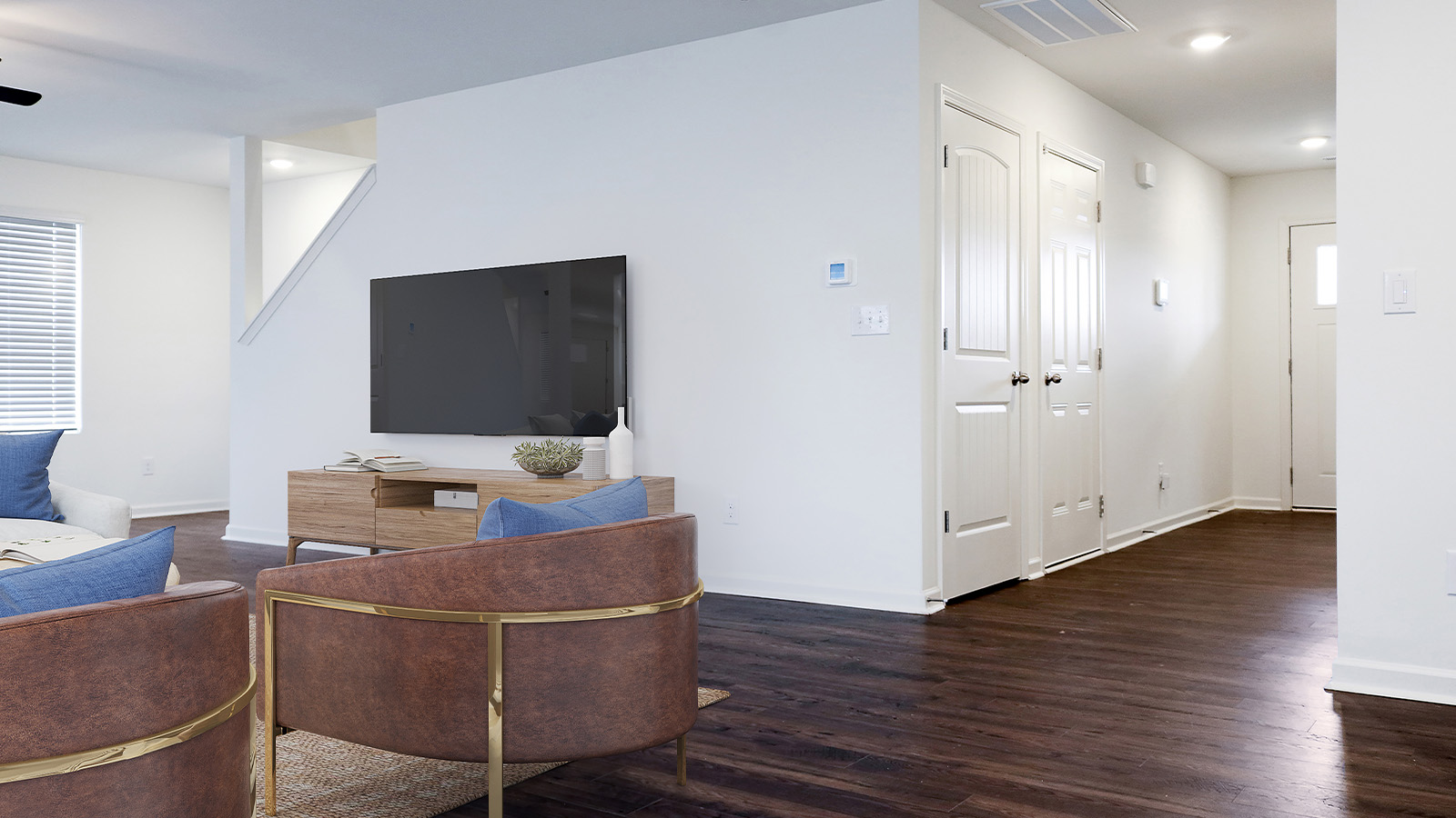 Off the living room is a coat closet, access to the garage, a powder bathroom, and a flex room.