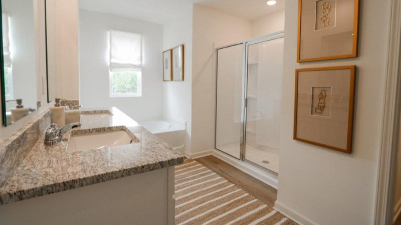 Welcome to the Carol Plan, a customer favorite of our new home communities in central, Alabama. Just over 2,500 square feet, this beautiful two- story home offers 5-bedrooms with 3-bathrooms, and a 2-car garage with a gorgeous open floor layout.   The gourmet kitchen has an oversized island for extra seating and a large pantry, and it opens to the dining area and a spacious living room. A bedroom with a full bathroom completes the main level. Bedroom One is on the second level and offers a luxurious bath with a soaking garden tub and separate shower, private bathroom, double vanities with marble counters and a large walk-in closet. There are 3 additional bedrooms, a full bathroom, a walk-in laundry room, and a loft-style living room on the second level. Quality materials and workmanship throughout, with superior attention to detail, plus a one-year builder's warranty. As a most popular favorite, this plan is ideal for any size family.    In addition, each home comes with a one-year builder's warranty to provide extra peace of mind. It's worth noting that our smart home technology package is also part of the deal. The included Smart Home Technology Package is designed for easy use and offers unparalleled convenience, enabling you to effortlessly control various key features with just a simple touch. Some of the highlighted conveniences of this package comprise lighting automation, an IQ panel, a video doorbell, keyless front door entry, and the ability to manage the temperature from the comfort of your phone. Call to schedule your personal guided tour of the Carol today!