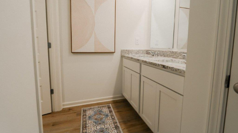 Welcome to the Carol Plan, a customer favorite of our new home communities in central, Alabama. Just over 2,500 square feet, this beautiful two- story home offers 5-bedrooms with 3-bathrooms, and a 2-car garage with a gorgeous open floor layout.   The gourmet kitchen has an oversized island for extra seating and a large pantry, and it opens to the dining area and a spacious living room. A bedroom with a full bathroom completes the main level. Bedroom One is on the second level and offers a luxurious bath with a soaking garden tub and separate shower, private bathroom, double vanities with marble counters and a large walk-in closet. There are 3 additional bedrooms, a full bathroom, a walk-in laundry room, and a loft-style living room on the second level. Quality materials and workmanship throughout, with superior attention to detail, plus a one-year builder's warranty. As a most popular favorite, this plan is ideal for any size family.    In addition, each home comes with a one-year builder's warranty to provide extra peace of mind. It's worth noting that our smart home technology package is also part of the deal. The included Smart Home Technology Package is designed for easy use and offers unparalleled convenience, enabling you to effortlessly control various key features with just a simple touch. Some of the highlighted conveniences of this package comprise lighting automation, an IQ panel, a video doorbell, keyless front door entry, and the ability to manage the temperature from the comfort of your phone. Call to schedule your personal guided tour of the Carol today!