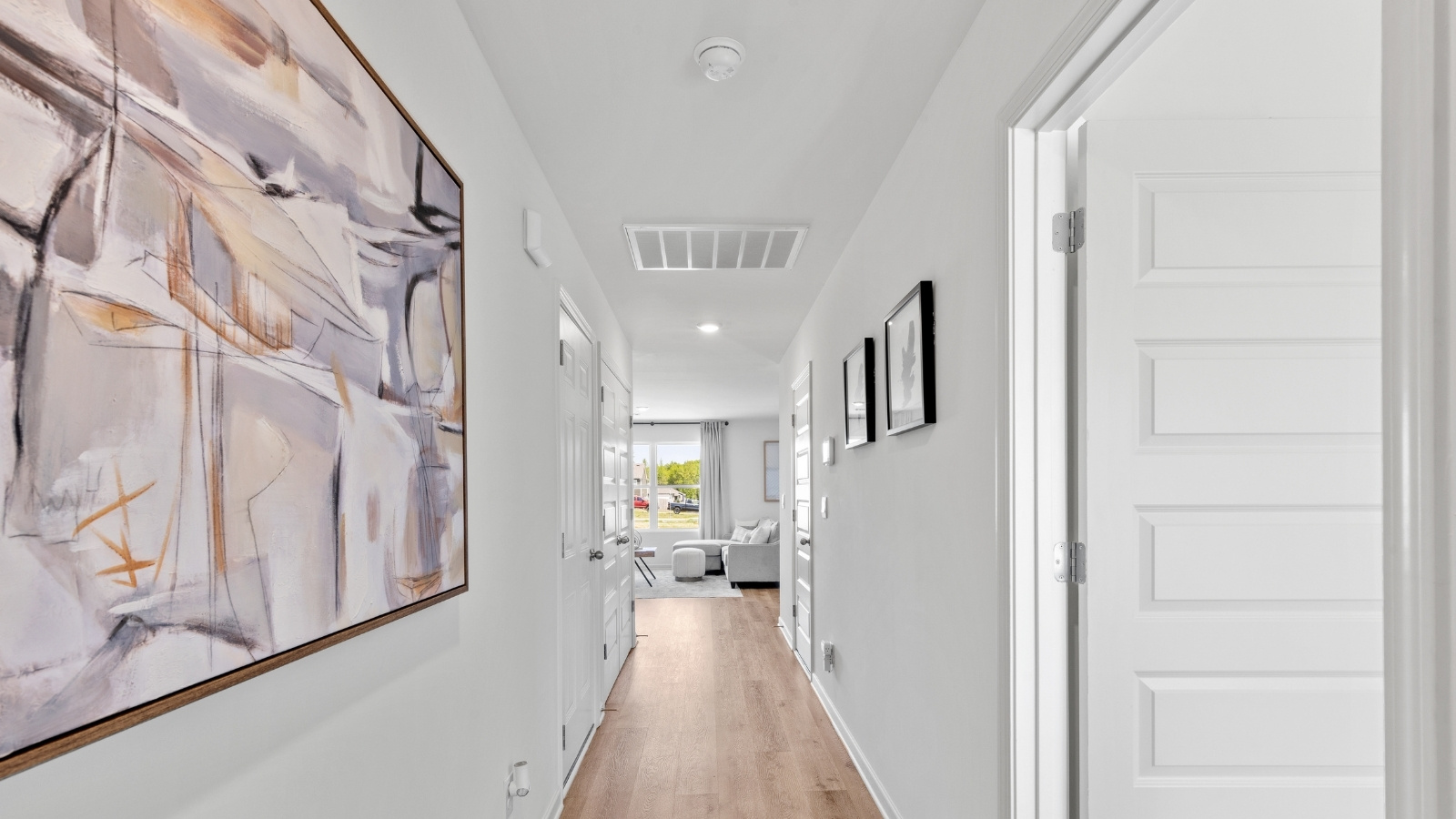 The entry hallway to the Aaron floorplan, leading into the open concept living space.