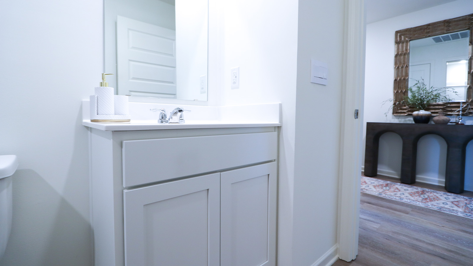 The second bathroom also features modern fixtures and a tub shower combo.