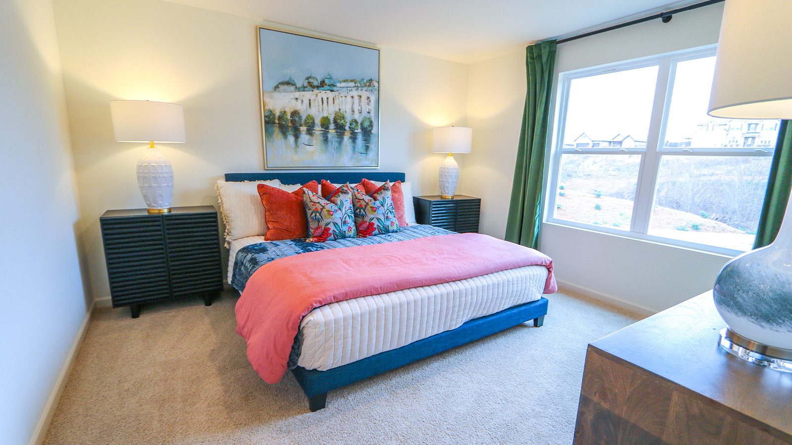 In the third bedroom, you'll find a comfortable bed with two nightstands and a dresser.