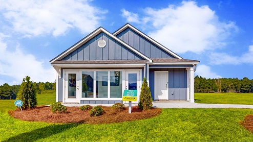 Burke – Front Exterior – A single story home surrounded by a spacious yard and lush green grass