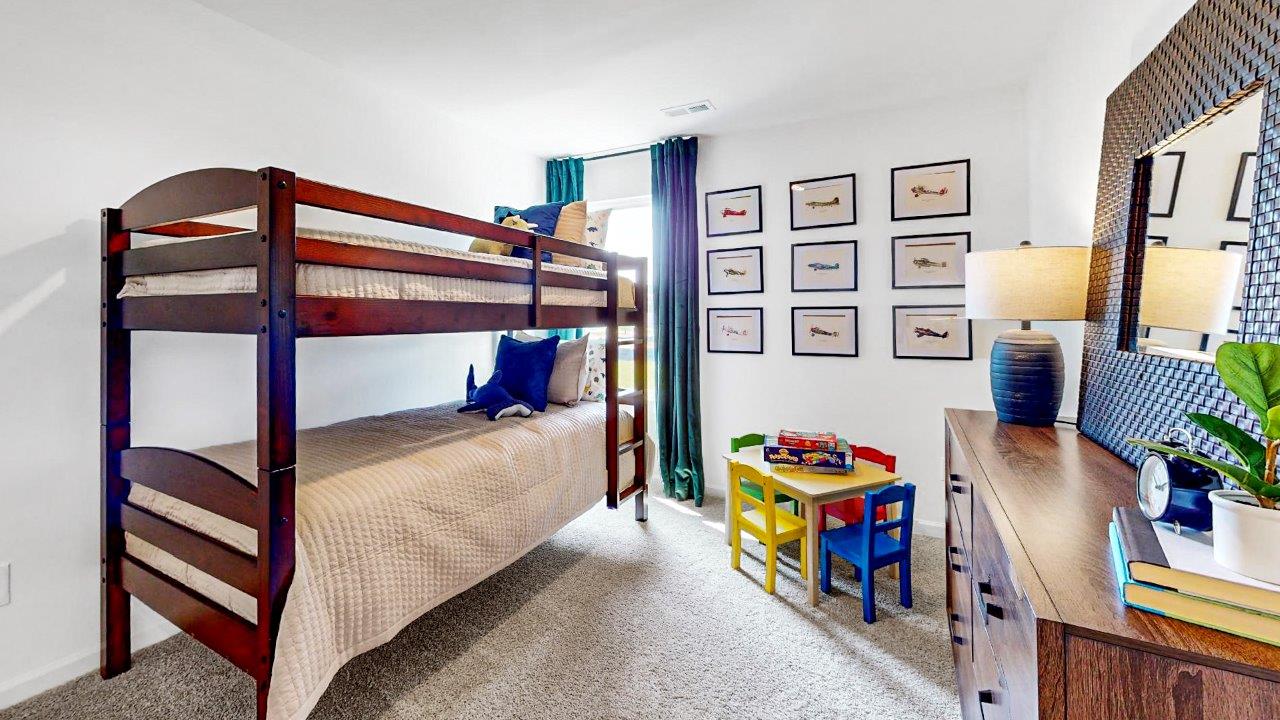 Burke – Bedroom 2 – A comfortable bedroom with bunk beds and a dressers, providing ample sleeping space and room to play