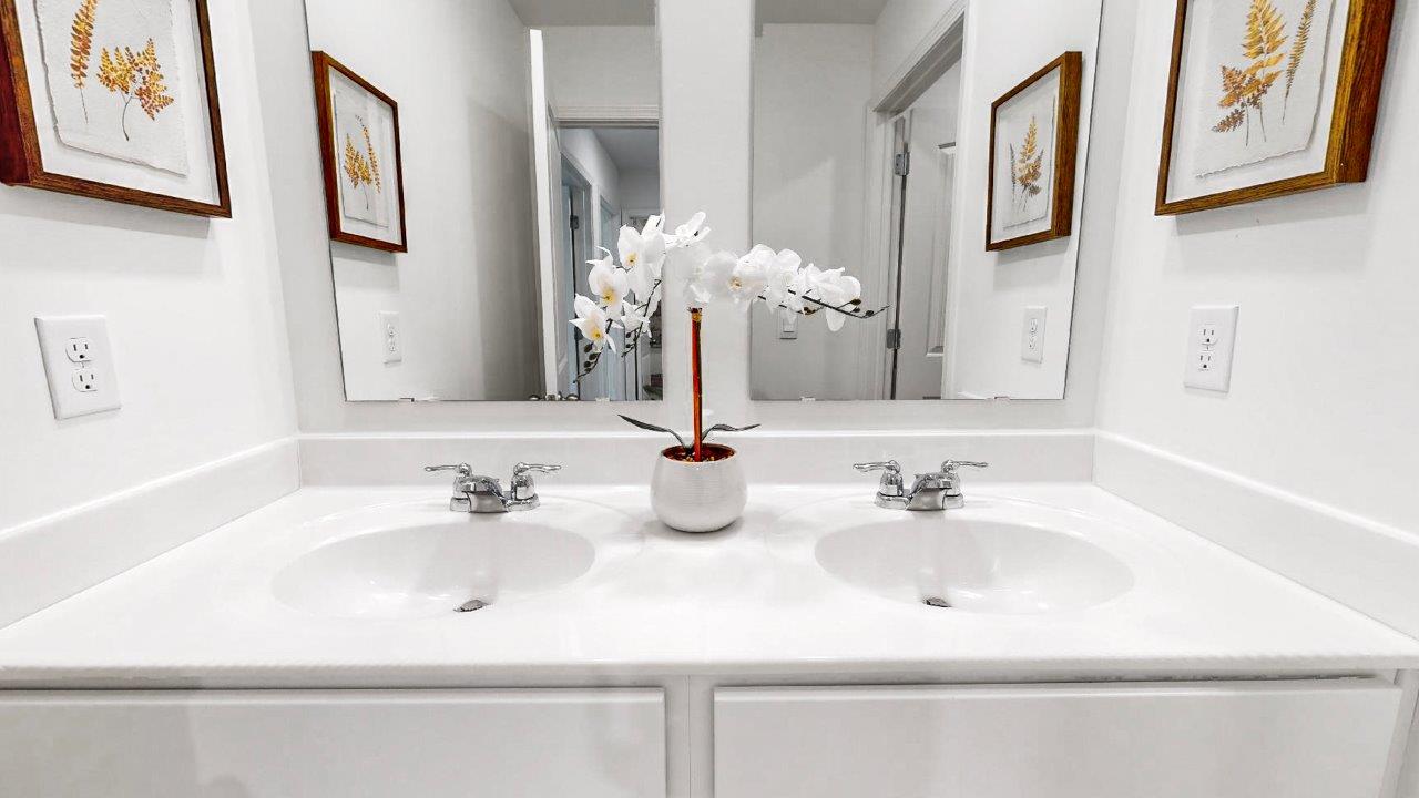13.	Taylor – Bathroom 2 – 1 – A bathroom with 2 sinks and a large mirror