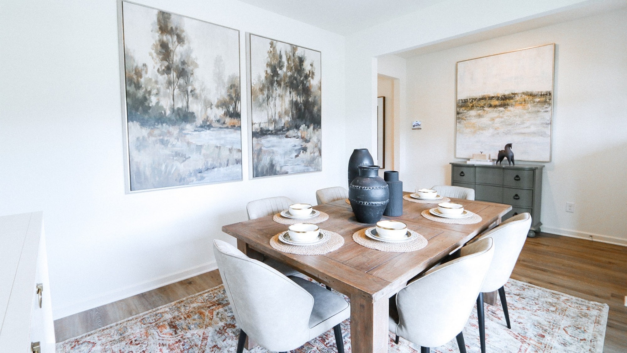 The open concept kitchen and dining space has ample room for a full set of dining room furniture. Shown here is a roomy dining set for 6 people.