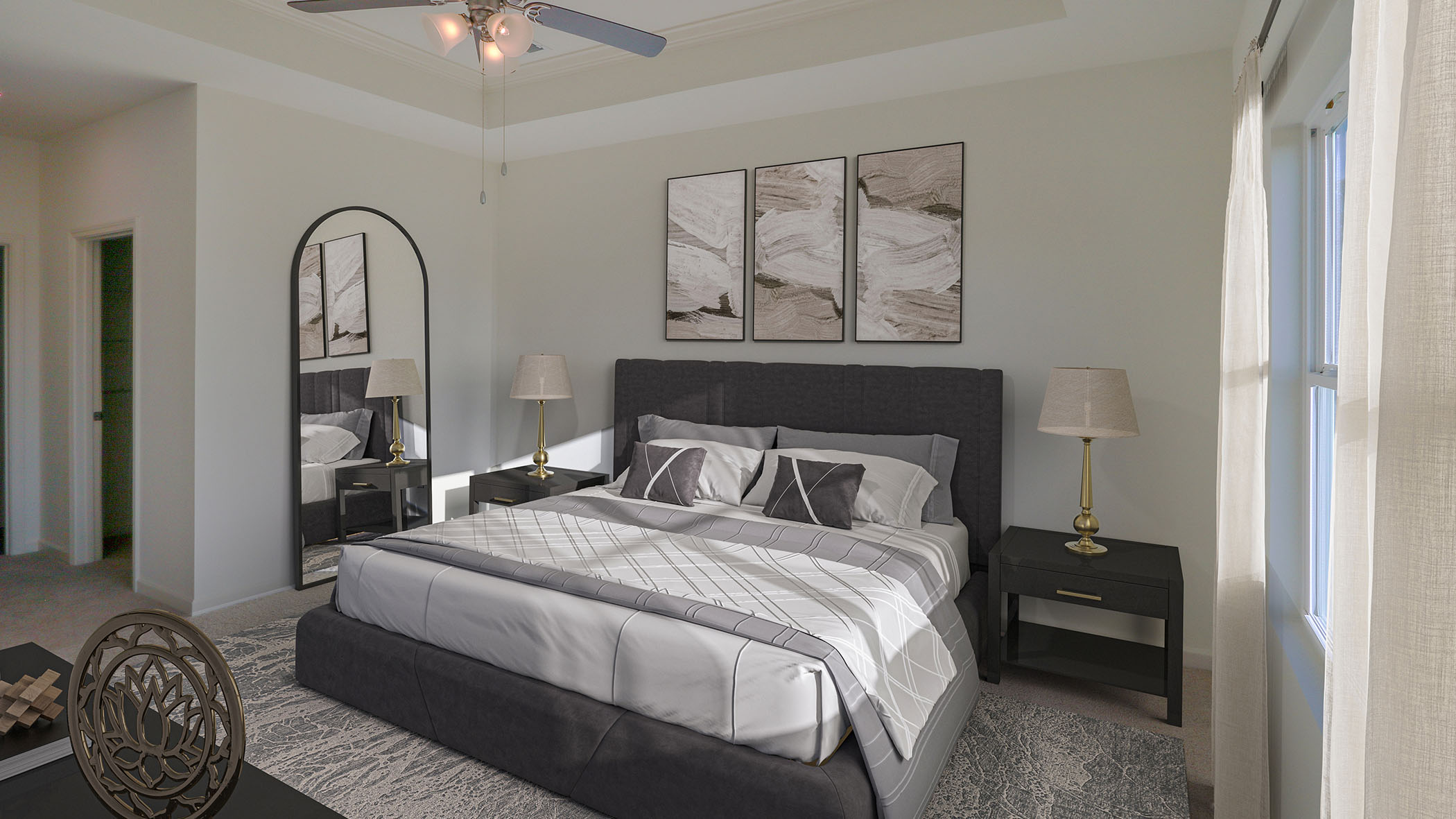 A cozy bedroom featuring a ceiling fan above a neatly made bed, creating a comfortable and inviting atmosphere.