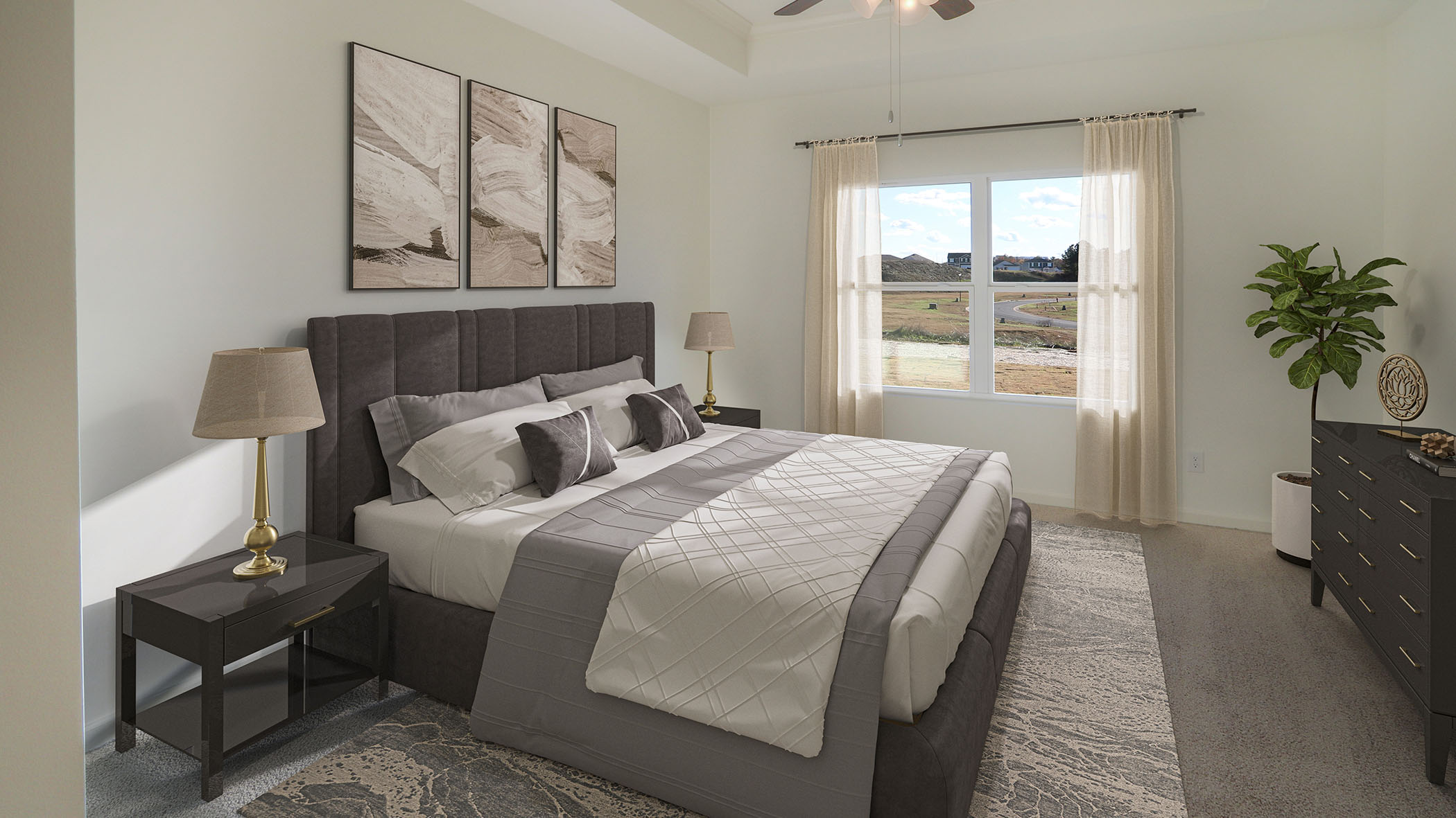 A cozy bedroom featuring a ceiling fan above a neatly made bed, creating a comfortable and inviting atmosphere.