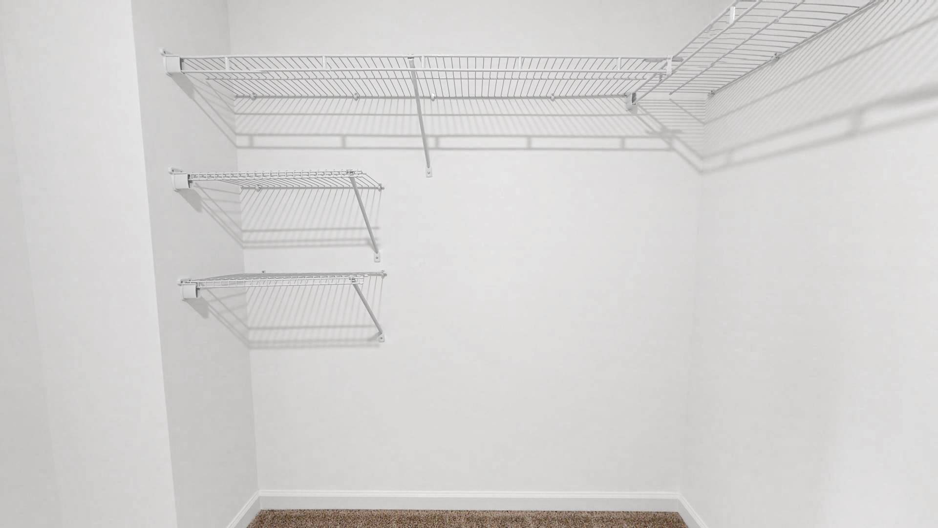 Spacious walk in closet with wire shelving