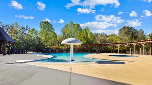 Welcome to Doss Ferry by D.R. Horton, in Kimberly, Alabama. Ideally located in northeast Jefferson County minutes from I-65. This new home community provides easy access to Hayden, Mount Olive, Gardendale’s conveniences, nearby Fultondale dining options, and excellent recreation spots throughout the area. Go Mortimer Jordan Blue Devils! With home plans ranging in size from 1,618 square feet up to 2,511 square feet, Doss Ferry offers a variety of home plans including one level open floor plans to a spacious two story. Each home in Doss Ferry is uniquely designed with modern living in mind, featuring granite countertops, elegant and durable flooring, and stainless-steel appliances. The easy-to-use Smart Home Technology Package included in every home provides the ultimate convenience, allowing you to control key features with the touch of a button. Featured conveniences include lighting automation, IQ panel, video doorbell, keyless front door entry, and temperature control from the ease of your phone. Doss Ferry is a unique living experience. Our community offers a spacious community pool, residents club, meandering walking trails with room to explore. Whether you are looking for a spacious open floor plan or a more intimate design, Doss Ferry has a variety of options to suit your individual needs. Doss Ferry’s location is perfect for accessing spots for hiking and biking adventures. In addition, state-of-the-art local parks and recreational opportunities are just minutes away, offering something for everyone. Take a personal tour of Doss Ferry today and discover how this beautiful new home community near Kimberly, Alabama, can perfectly match your lifestyle.
