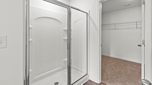 Penwell – Primary Bathroom – 1 – A bathroom with two sinks and a plant, creating a refreshing and functional space.