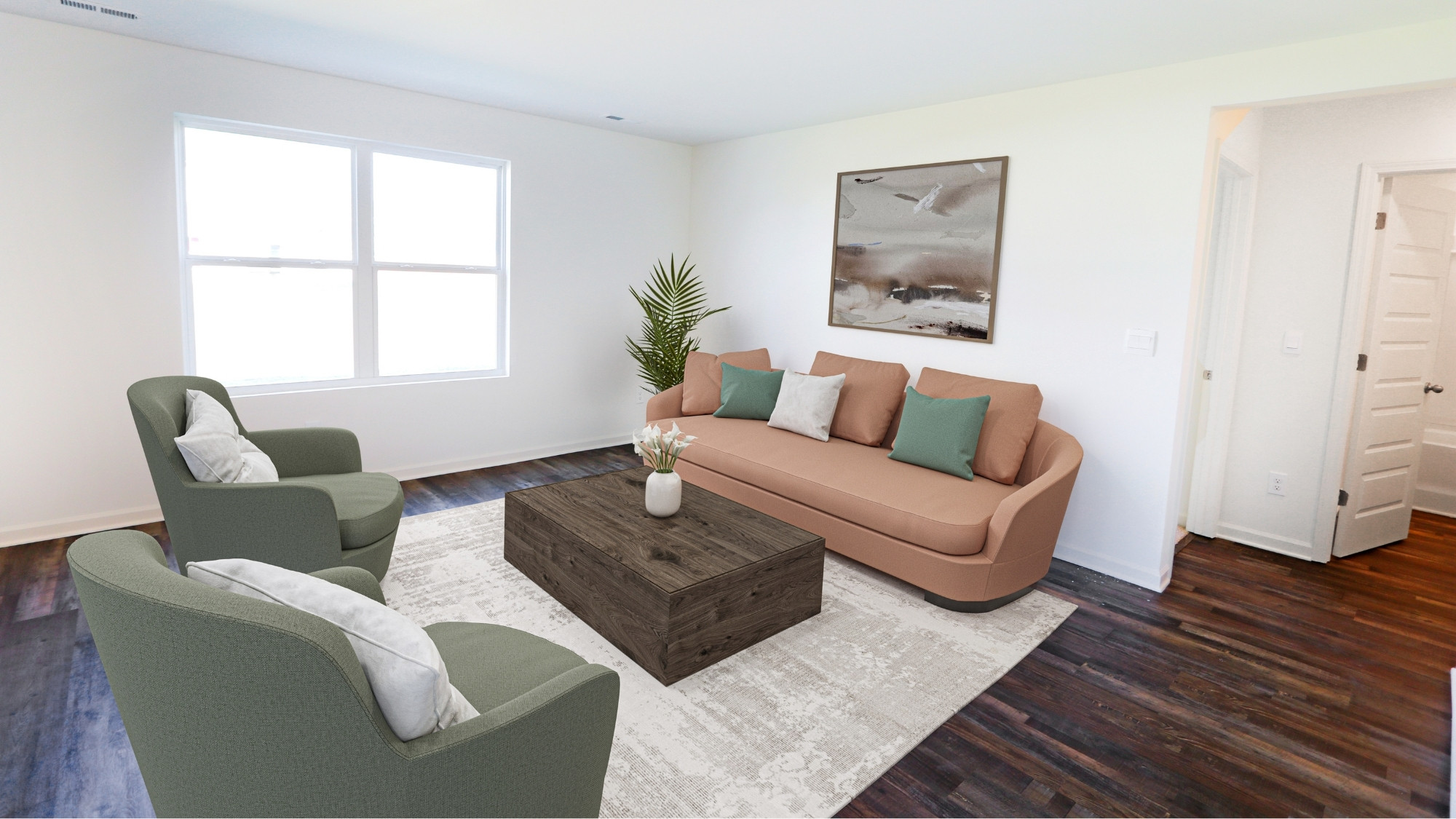 Another view of the spacious living room, here staged with a large couch, large coffee table, and two armchairs.
