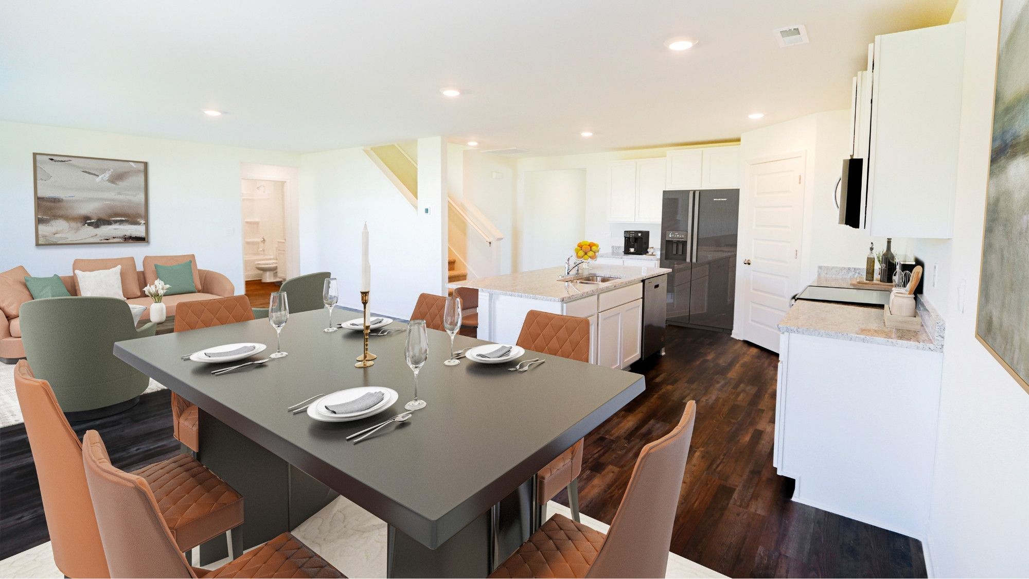 The kitchen area blends seamlessly into the living and dining areas, allowing for the whole family to spend time together.