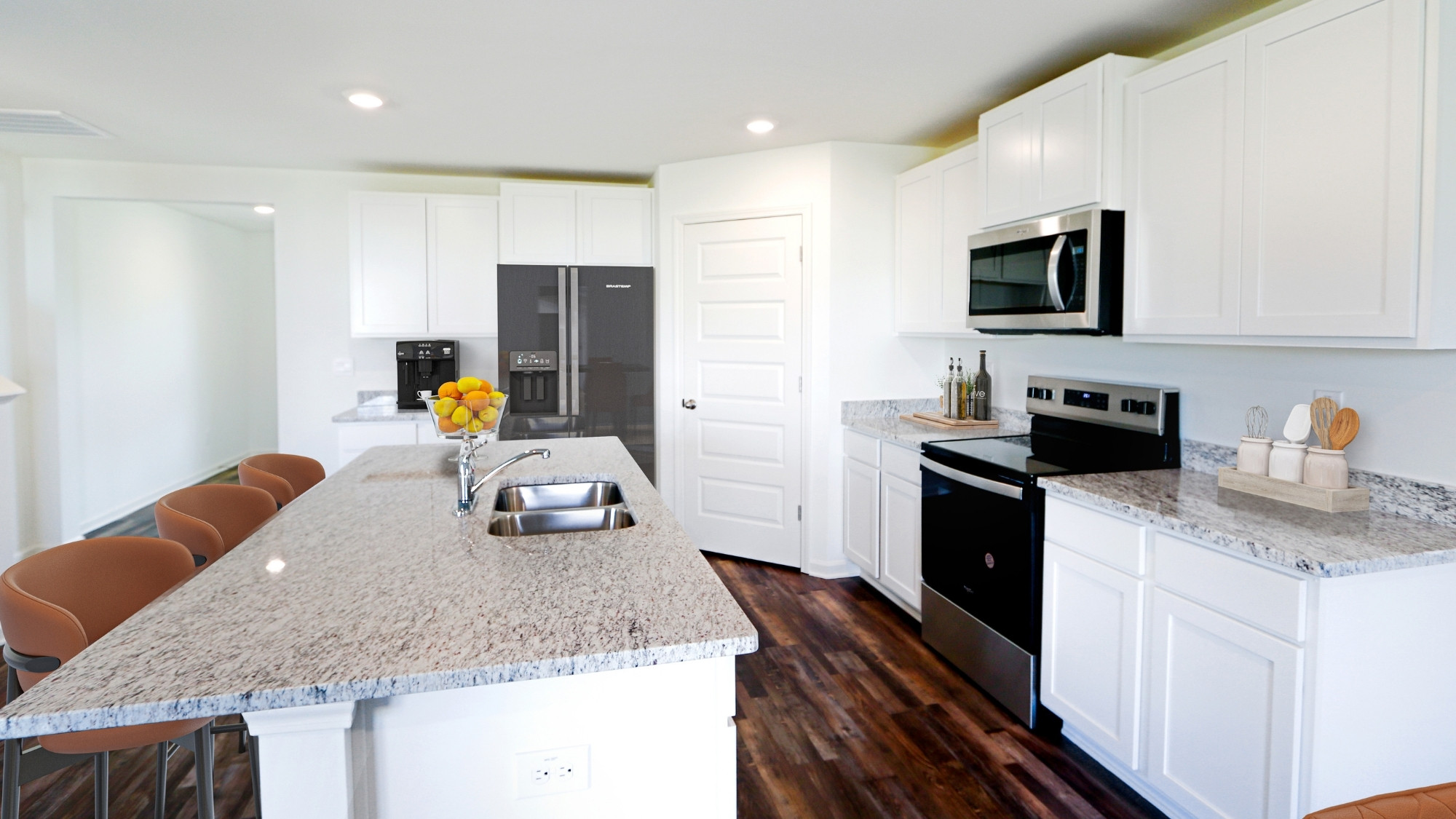 The modern kitchen is roomy enough for the whole family to eat and cook together.