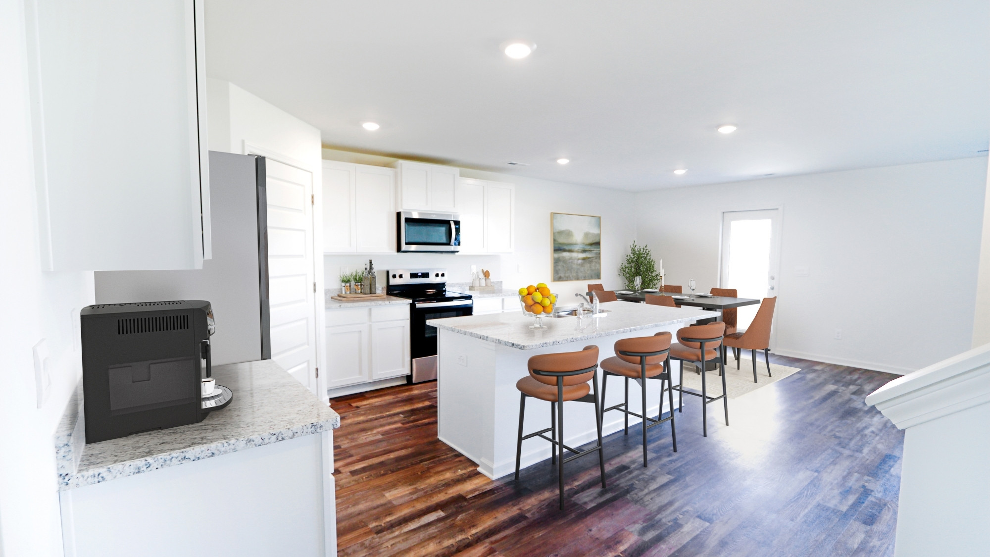 Another view of the spacious kitchen area, with a view of the dining area.