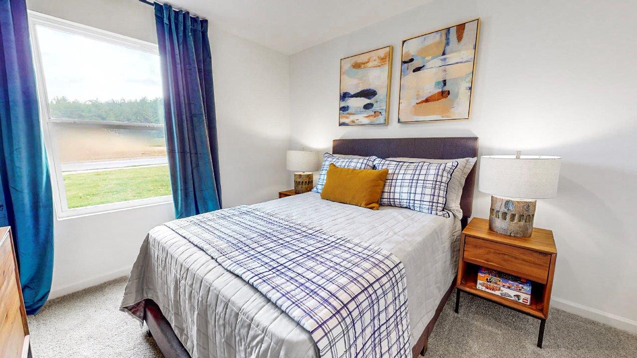 Third bedroom features a bed with 2 nightstand and a dresser.