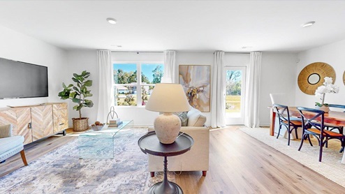 A spacious living room that opens to the dining room