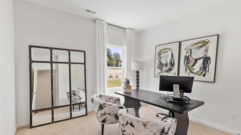 One of the bedrooms is shown here staged as an upstairs living area.