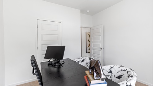 One of the bedrooms is shown here staged as an upstairs living area.