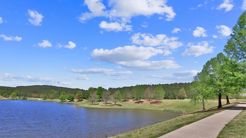A unique 100-foot-tall clock tower stands watch over the grand entrance to Chelsea Park by D.R. Horton, the premiere community in Chelsea, Alabama. Conveniently located to Chelsea Community Center including activities for every age. Nearby residents can enjoy the community splashpad, archery range, and a host of youth sports complexes. Situated minutes from highway 280, this new home community provides easy access to Chelsea, Greystone’s conveniences, nearby dining options, and excellent recreation spots throughout the region. Go Chelsea Hornets! With home plans ranging in size from 1,613 square feet up to 2,511 square feet, Chelsea Park offers a variety of home plans including one level ranchers to a spacious two story. Each home in Chelsea Park is uniquely designed with modern living in mind, featuring granite countertops, elegant and durable flooring, and stainless-steel appliances. The easy-to-use Smart Home Technology Package included in every home provides the ultimate convenience, allowing you to control key features with the touch of a button. Featured conveniences include lighting automation, IQ panel, video doorbell, keyless front door entry, and temperature control from the ease of your phone. Whether you are looking for a spacious open floor plan or a more intimate design, Chelsea Park has a variety of options to suit your individual needs. For the outdoor enthusiasts, Chelsea Park’s location is perfect for accessing spots for hiking and biking adventures. In addition, state-of-the-art local parks and recreational opportunities are just minutes away, offering something for everyone. Chelsea, Alabama has been consistently voted as one of the “Best Places to Live in Alabama.” Come tour Chelsea Park today and join this vibrant community.