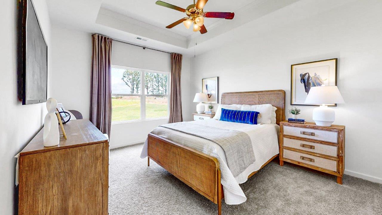 Rhett – Primary Bedroom – Large king size bed, two night stands and a dresser complete the primary bedroom