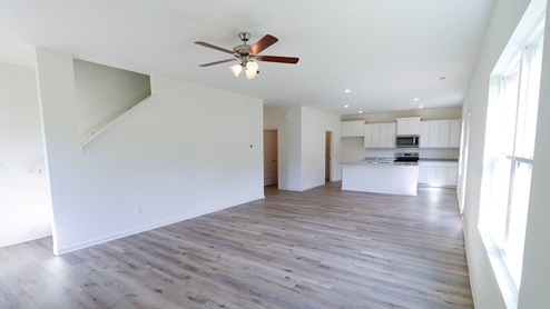 Spacious living area with modern design, perfect for creating your dream home. LIVING_2- Bright and spacious living room with large windows, perfect for creating a cozy home atmosphere.