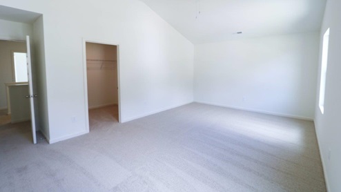 Bright and spacious room showcasing fresh carpet and natural light, perfect for your new home. MASTERBED_2- Bright and spacious bedroom featuring a ceiling fan and modern white walls, perfect for a cozy retreat.
