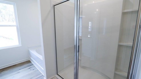 Bright and spacious bathroom featuring double sinks and modern fixtures, perfect for a stylish home upgrade. MASTERBATH_2- Bright and modern bathroom featuring a spacious walk-in shower and soaking tub, perfect for relaxation and comfort. MASTERBATH_3- Spacious and clean bathroom featuring modern fixtures and handy storage options. MASTERBATH- Relax in this spacious, modern bathtub featuring sleek design and easy access to natural light. MASTERBATH_5- Modern shower design with clear glass doors and minimalist storage, perfect for a stylish bathroom update. MASTERBATH_6- Beautiful double sink vanity with granite countertop and mirrors, perfect for modern bathroom designs. MASTERBATH_7- Bright and spacious bathroom featuring elegant granite countertops and modern finishes for a stylish home upgrade.