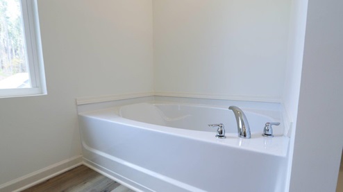 Bright and spacious bathroom featuring double sinks and modern fixtures, perfect for a stylish home upgrade. MASTERBATH_2- Bright and modern bathroom featuring a spacious walk-in shower and soaking tub, perfect for relaxation and comfort. MASTERBATH_3- Spacious and clean bathroom featuring modern fixtures and handy storage options. MASTERBATH- Relax in this spacious, modern bathtub featuring sleek design and easy access to natural light. MASTERBATH_5- Modern shower design with clear glass doors and minimalist storage, perfect for a stylish bathroom update. MASTERBATH_6- Beautiful double sink vanity with granite countertop and mirrors, perfect for modern bathroom designs. MASTERBATH_7- Bright and spacious bathroom featuring elegant granite countertops and modern finishes for a stylish home upgrade.