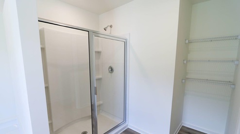 Bright and spacious bathroom featuring double sinks and modern fixtures, perfect for a stylish home upgrade. MASTERBATH_2- Bright and modern bathroom featuring a spacious walk-in shower and soaking tub, perfect for relaxation and comfort. MASTERBATH_3- Spacious and clean bathroom featuring modern fixtures and handy storage options. MASTERBATH- Relax in this spacious, modern bathtub featuring sleek design and easy access to natural light. MASTERBATH_5- Modern shower design with clear glass doors and minimalist storage, perfect for a stylish bathroom update. MASTERBATH_6- Beautiful double sink vanity with granite countertop and mirrors, perfect for modern bathroom designs. MASTERBATH_7- Bright and spacious bathroom featuring elegant granite countertops and modern finishes for a stylish home upgrade.