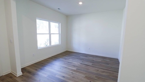 Bright and airy living room perfect for creating a cozy and inviting home atmosphere. Bright and airy empty room featuring large windows and new wood flooring, ideal for your home design ideas.