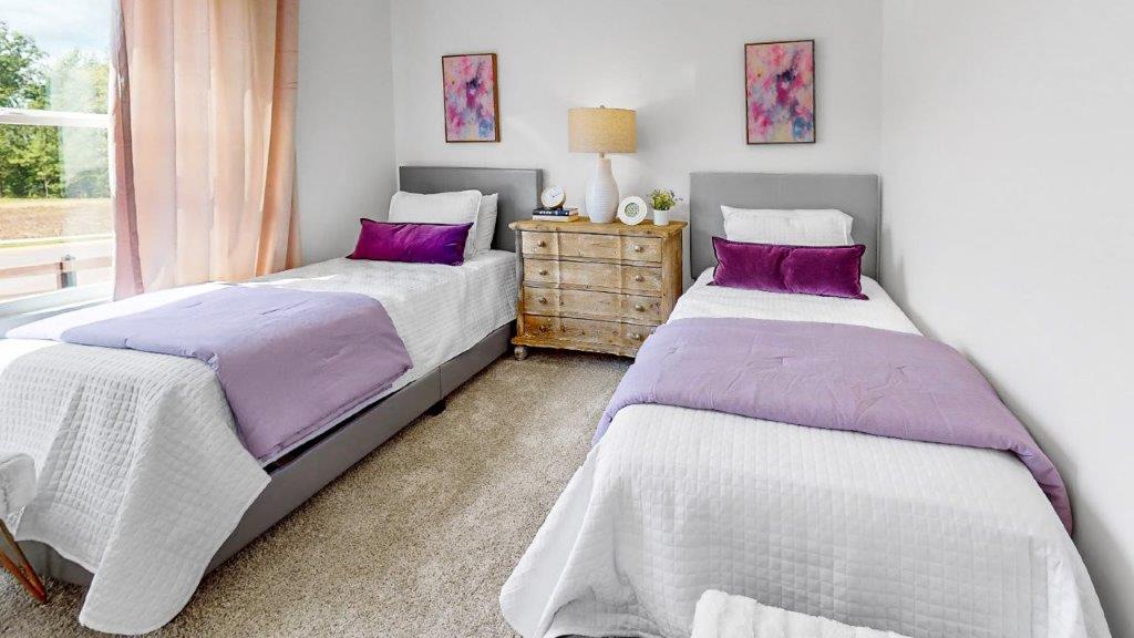 Two twin beds and a shared nightstand