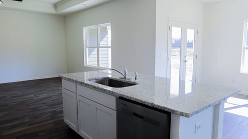 Bright and spacious kitchen featuring modern appliances and ample countertop space, perfect for cooking and entertaining. The kitchen is bright and spacious, with plenty of natural light and room to move around. It is equipped with modern appliances, making meal preparation convenient and efficient. There is ample countertop space, providing plenty of room for cooking and food preparation. This kitchen is perfect for both cooking and entertainment, with its inviting layout and functionality.