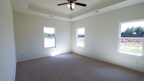 Bright and airy new home bedroom filled with natural light, perfect for relaxation and comfort. The new home bedroom is bright and airy, creating a welcoming and comfortable atmosphere. It is filled with natural light, which adds to the sense of spaciousness and relaxation.