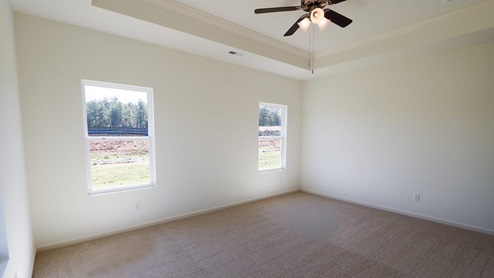 Bright and airy new home bedroom filled with natural light, perfect for relaxation and comfort. The new home bedroom is bright and airy, creating a welcoming and comfortable atmosphere. It is filled with natural light, which adds to the sense of spaciousness and relaxation.