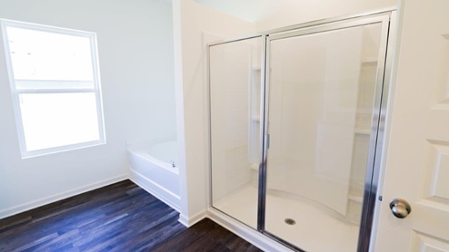 Modern bathroom with a spacious double vanity and granite countertops, perfect for stylish home renovations. This modern bathroom features spacious double vanity and granite countertops, making it ideal for stylish home renovations.