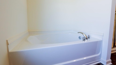 Modern bathroom with a spacious double vanity and granite countertops, perfect for stylish home renovations. This modern bathroom features spacious double vanity and granite countertops, making it ideal for stylish home renovations.