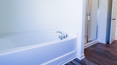 Modern bathroom with a spacious double vanity and granite countertops, perfect for stylish home renovations. This modern bathroom features spacious double vanity and granite countertops, making it ideal for stylish home renovations.