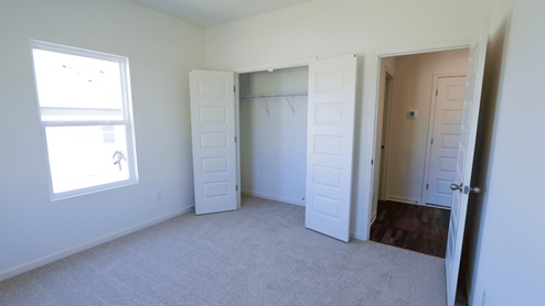 Bright and airy room featuring two windows that allow natural light to fill the space, perfect for a cozy and welcoming atmosphere. This room is bright and airy, with two windows that let in plenty of natural light. The abundance of natural light creates a cozy and welcoming atmosphere in the space.
