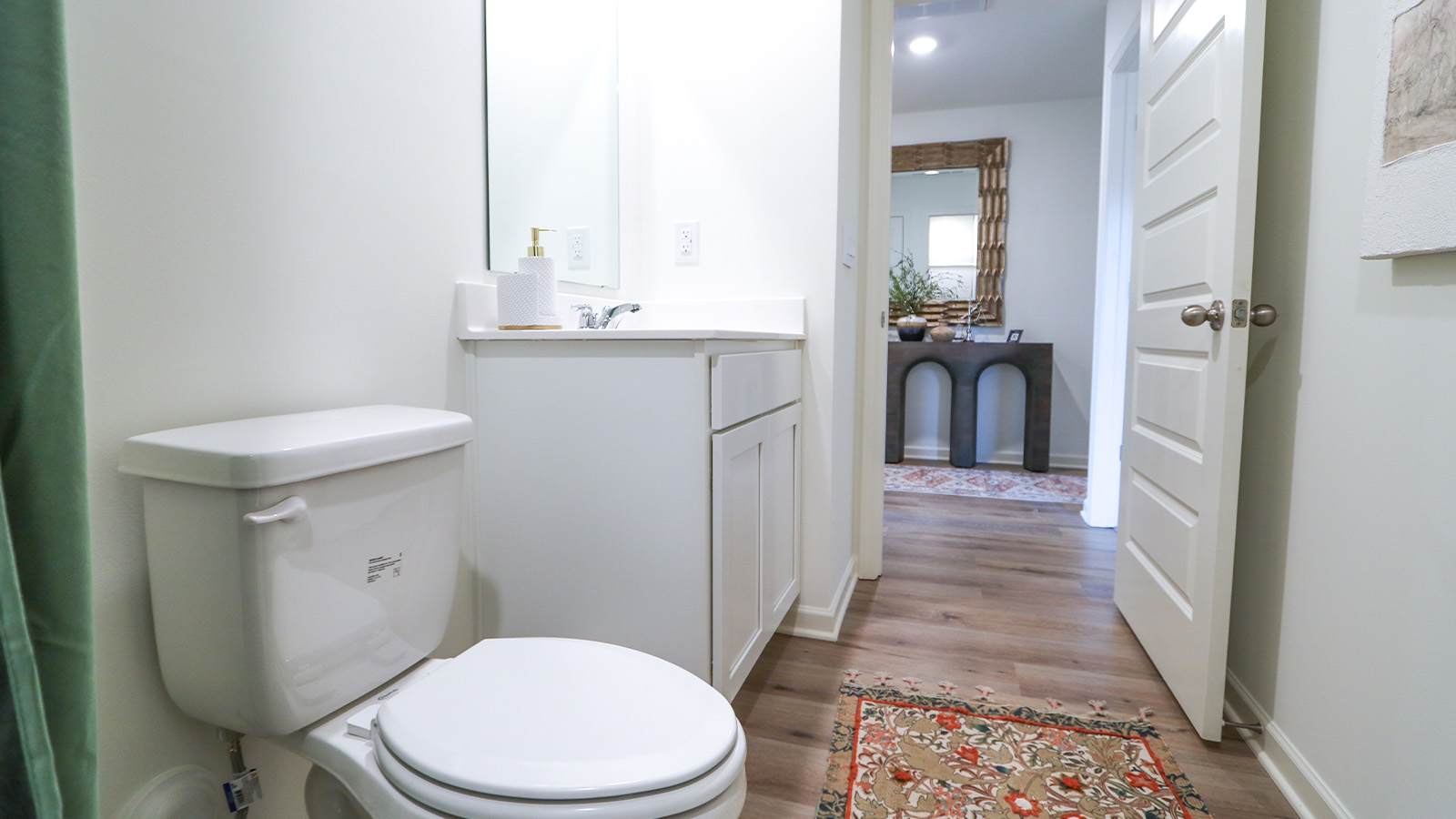 The second bathroom also features modern fixtures and a tub shower combo.