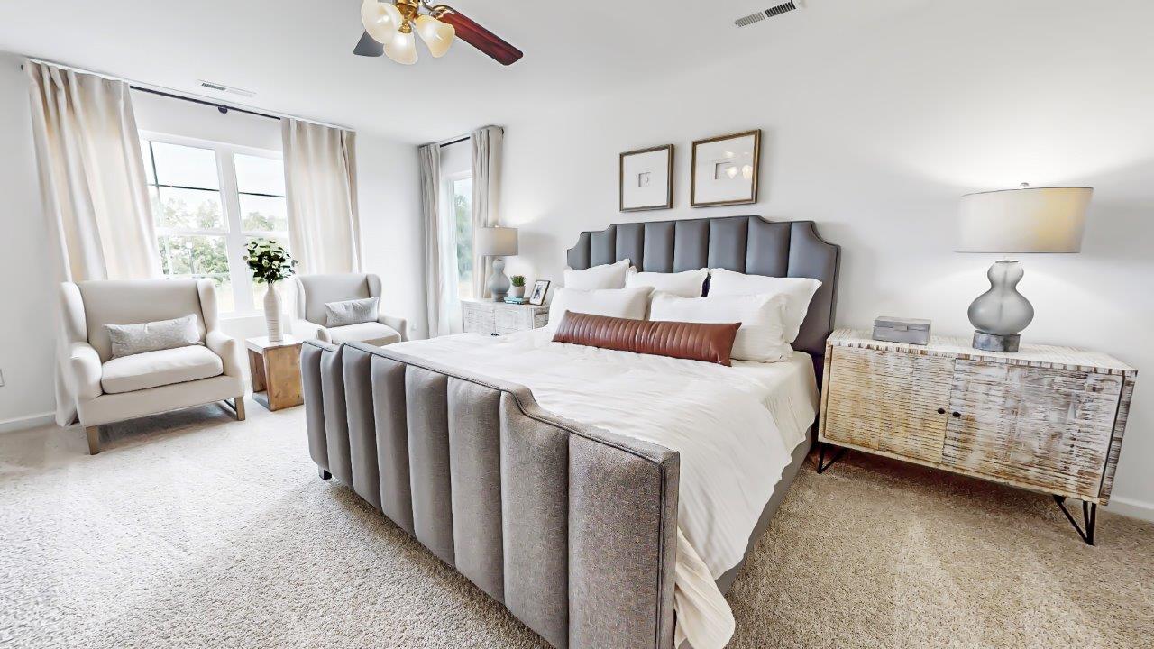 Primary Bedroom second level expansive primary bedroom consists of a large king sized bed, 2 oversized night tables, a dresser and two large guest chairs