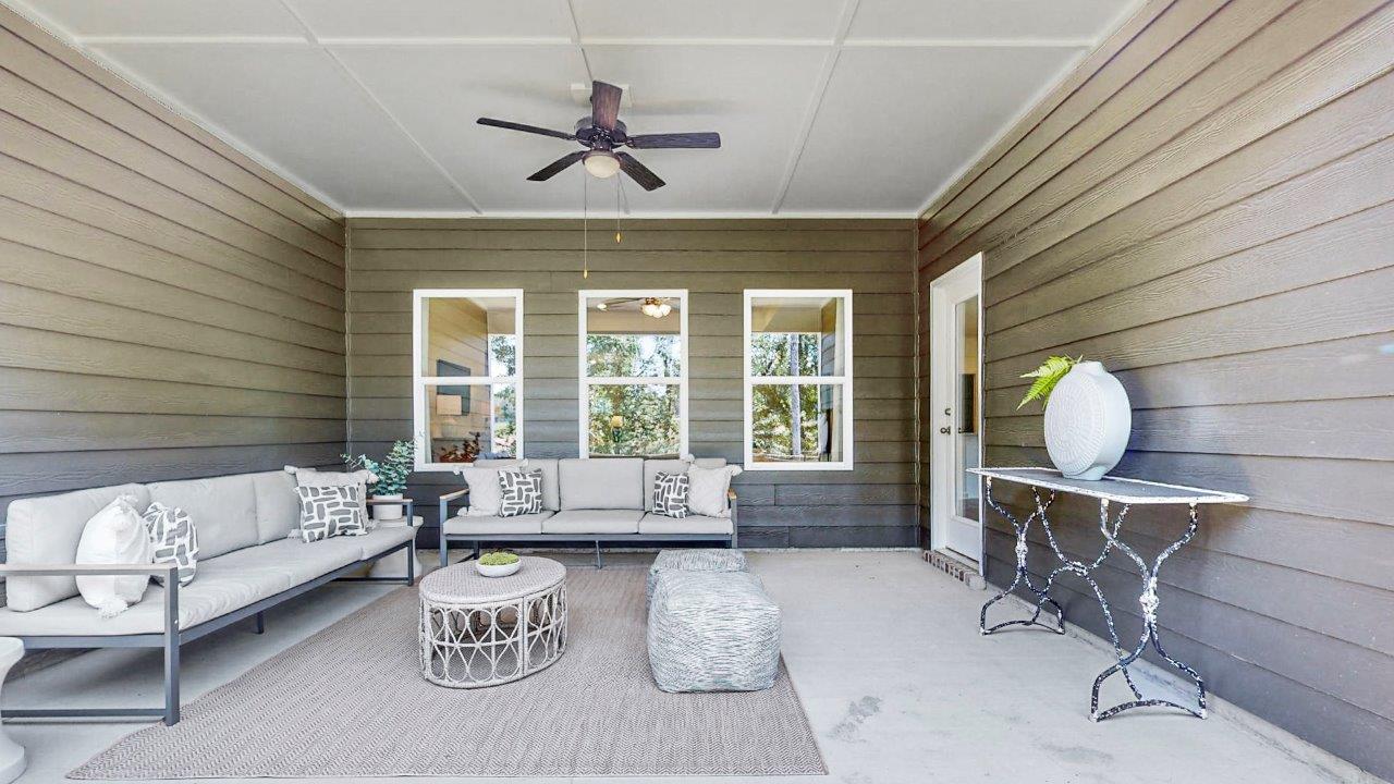Destin – Exterior Patio – the large covered patio in the back of the home is large and open with outdoor couches and coffee table with more room
