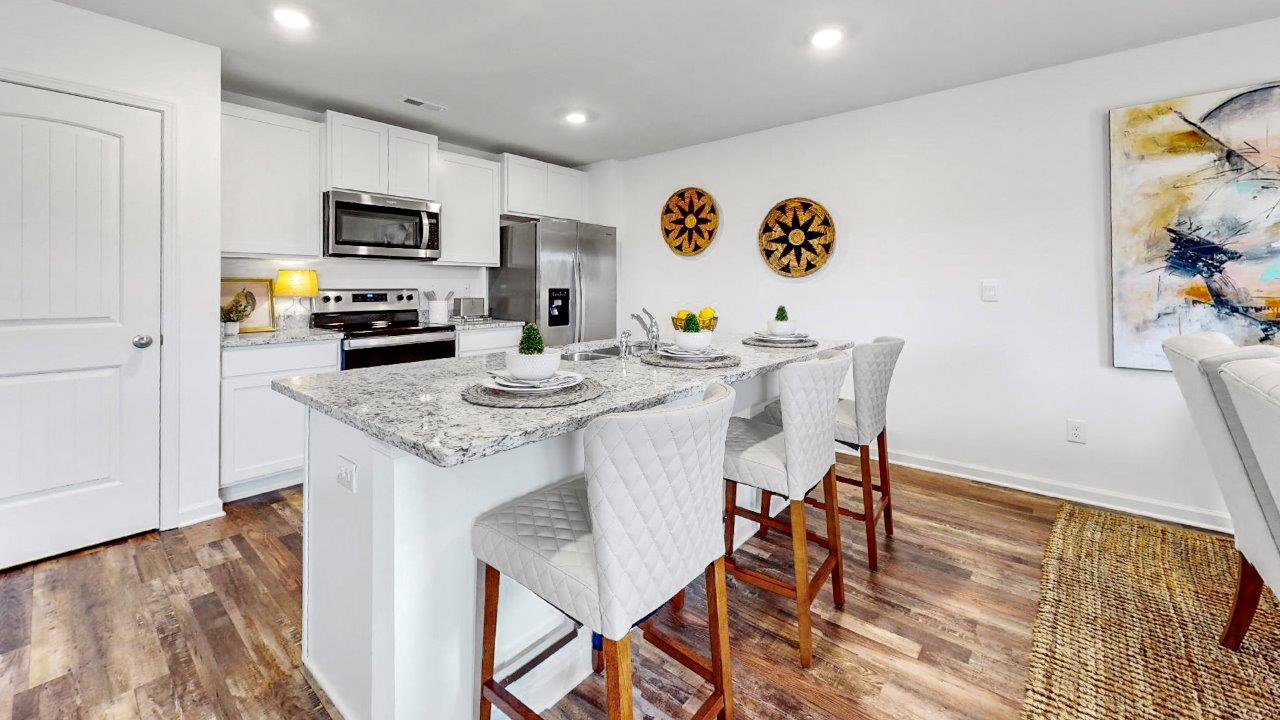 Freeport – Kitchen – 2 – A chef inspired kitchen that features a pantry, stainless steel appliances, and a large kitchen island