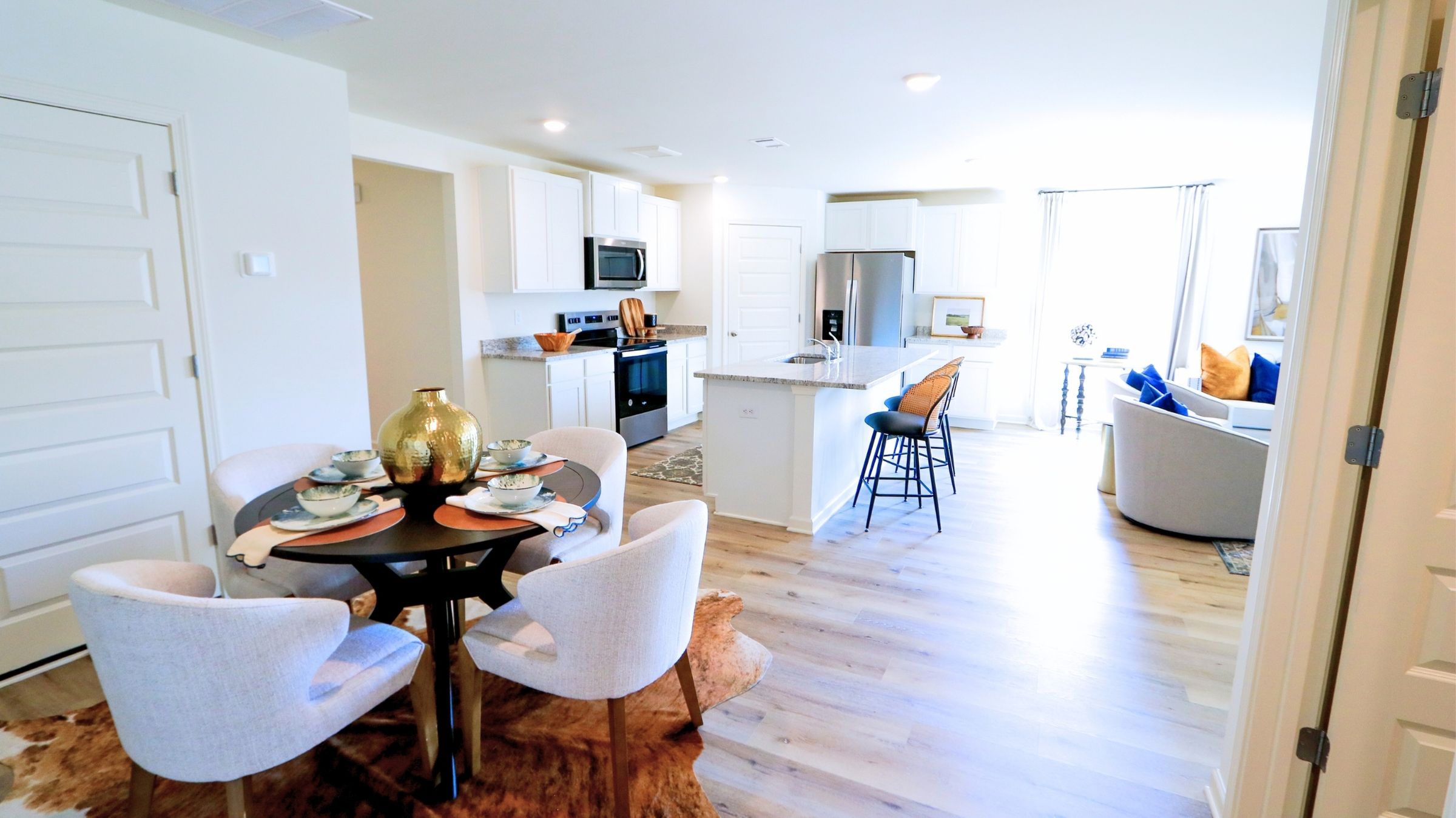 The Lakeside floor plan features a luxurious 5-bedroom, 3-bathroom residence with a two-car garage and exquisite details. The kitchen showcases a stunning design with quartz countertops, an undermount sink, a spacious island bar, top-of-the-line stainless-steel appliances, and a convenient corner pantry. This kitchen is seamlessly connected to the family room, making it perfect for hosting gatherings and spending quality time with loved ones. Adjacent to the kitchen, there is a delightful breakfast nook and a separate dining area. The home is filled with abundant natural light, creating a serene and inviting atmosphere. Stepping outside onto the expansive porch that leads to the backyard enhances the relaxing ambiance. Bedroom 1 offers ample space and comes with an adjoining bath featuring a double vanity, a generous sized shower, and a walk-in closet. The home is crafted with superior materials and workmanship, showcasing meticulous attention to detail, and is backed by a one-year builder's warranty.