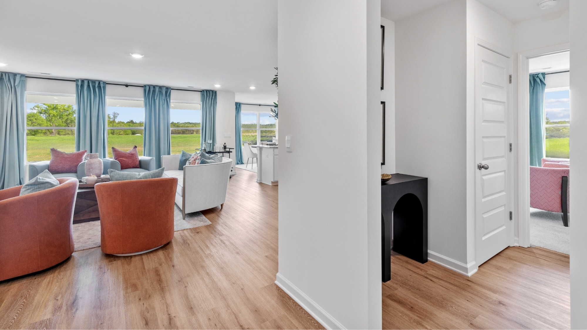 The large living room has space for basically any size couch, a large coffee table, and two large armchairs.