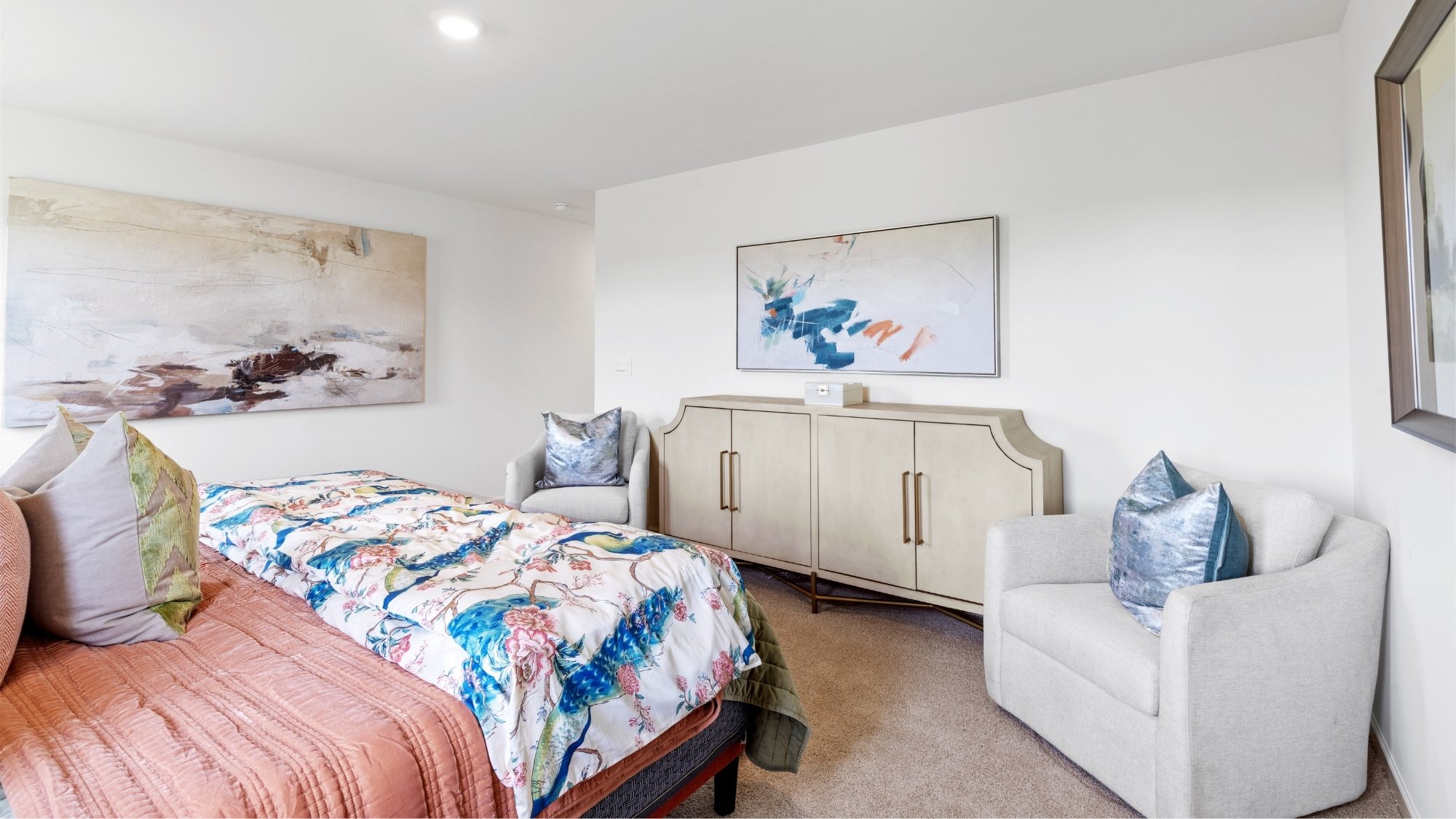 A cozy living room with a comfortable couch, a stylish coffee table, and a sleek television.