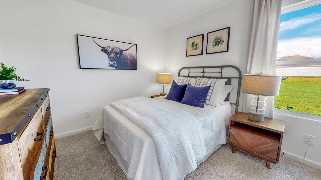 Aldridge – Bedroom 2 – the second bedroom features a bed, two nightstands and a dresser