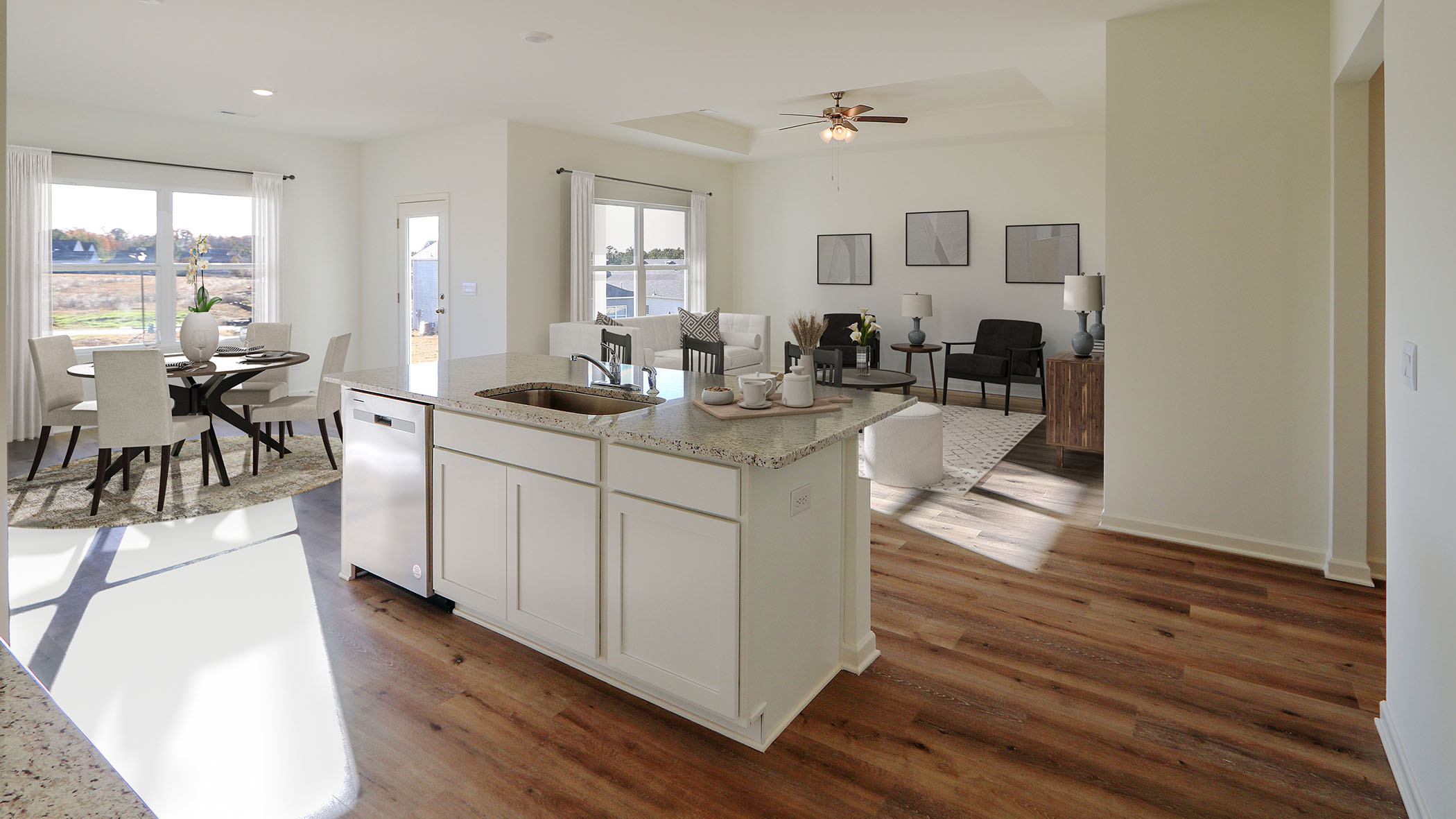 A cozy kitchen and dining room area featuring modern appliances and a welcoming dining table for family gatherings.